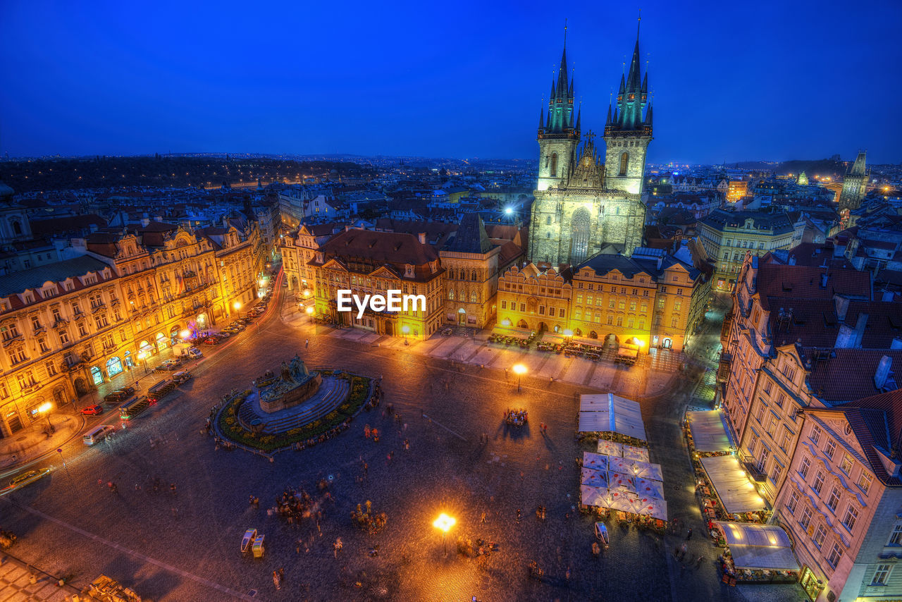 High angle view of illuminated buildings in city at night