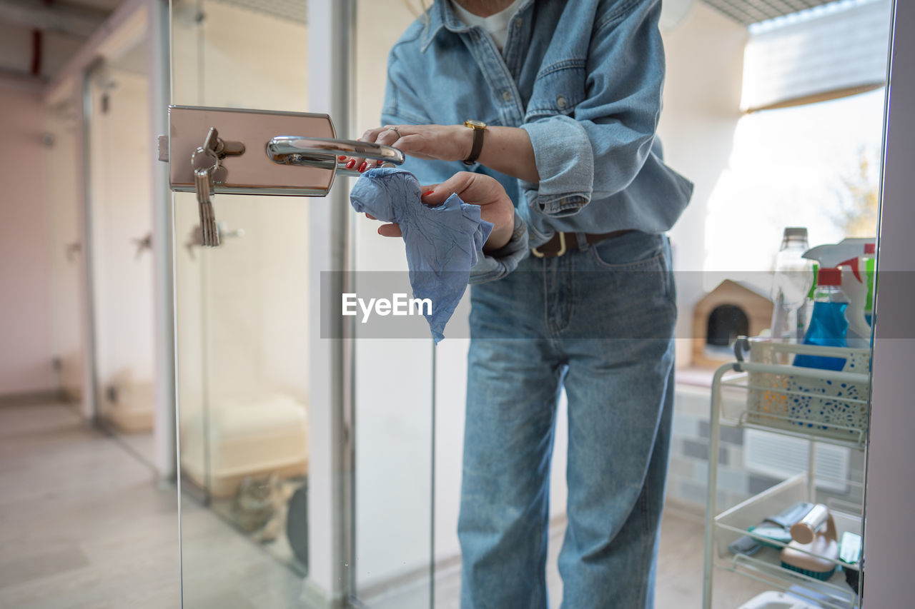 low section of man holding gun