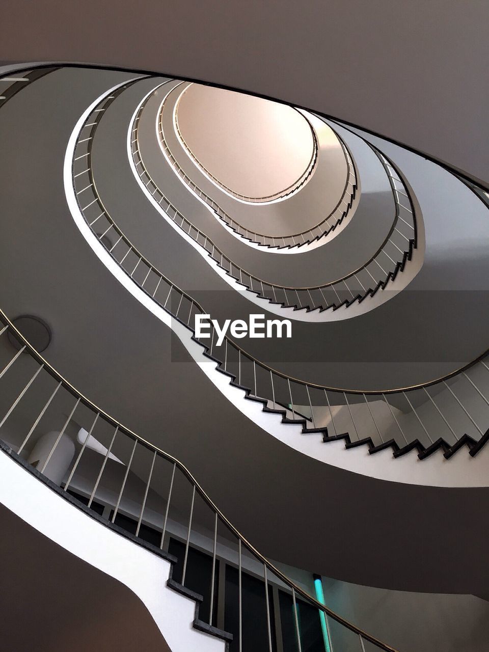 LOW ANGLE VIEW OF SPIRAL STAIRCASE OF BUILDING