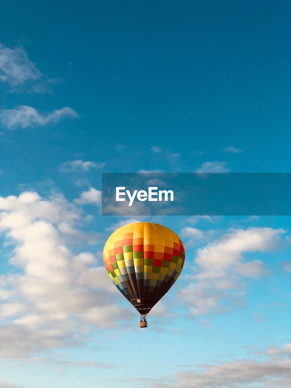 Low angle view of hot air balloon flying against sky