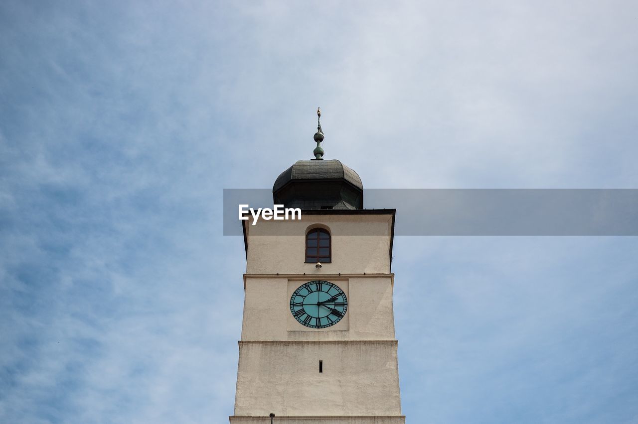 Low angle view of clock tower against sky