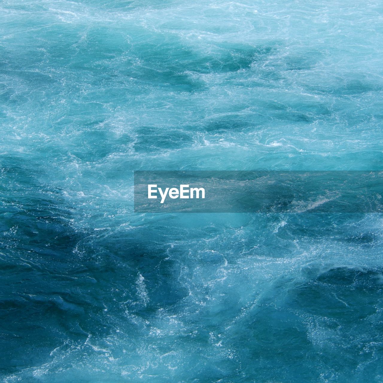 Full frame shot of the swirling water of the waikato river taken near the huka falls, taupo, nz.