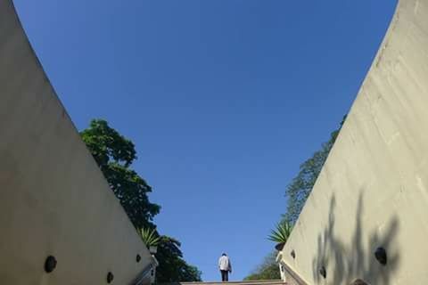 LOW ANGLE VIEW OF BUILT STRUCTURES AGAINST CLEAR BLUE SKY