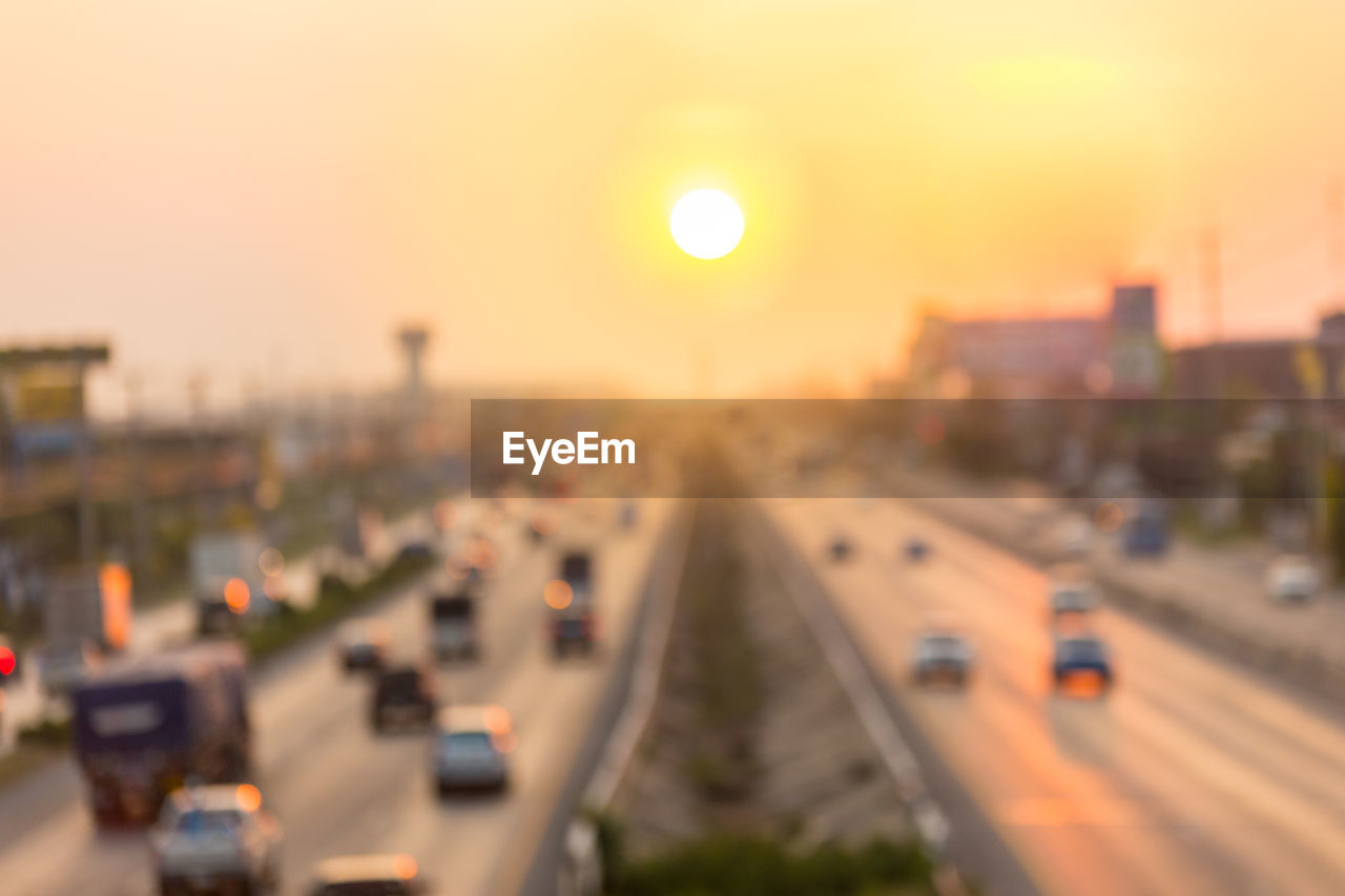 HIGH ANGLE VIEW OF TRAFFIC ON CITY DURING SUNSET