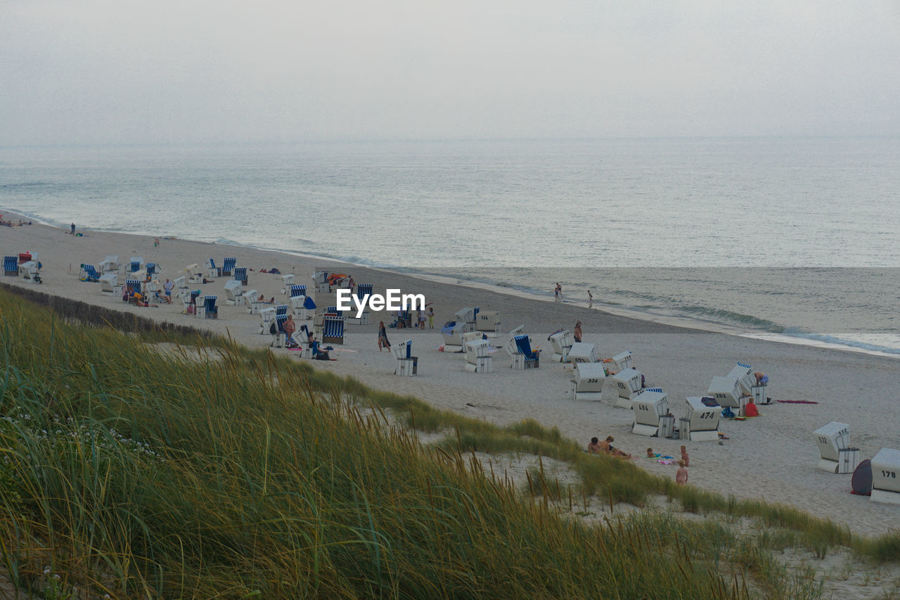 Scenic view of beach and sea against clear sky