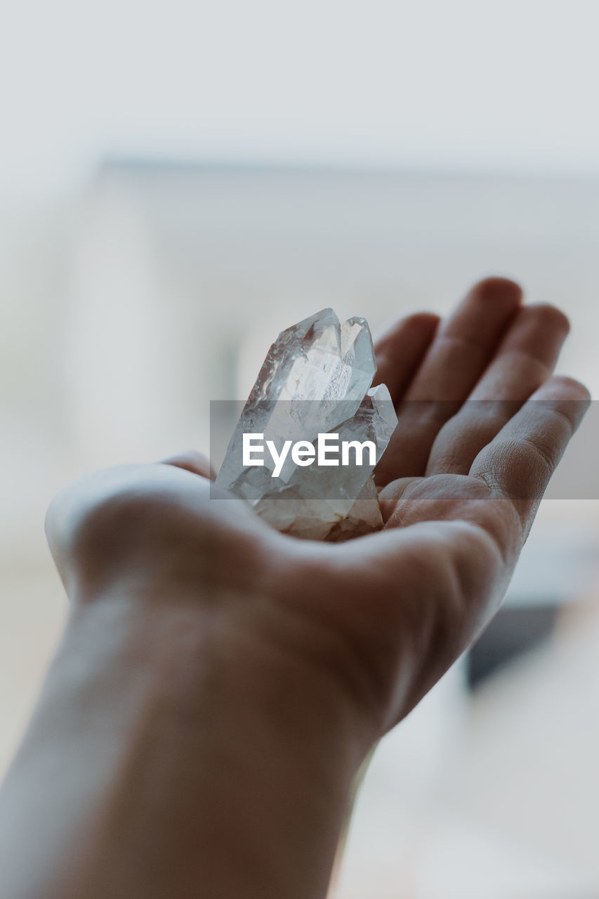 Close-up of hand holding crystals