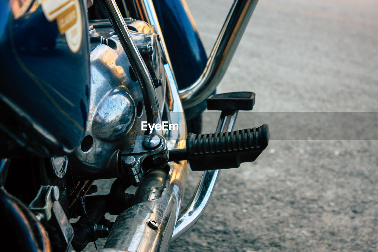 Close-up of motorcycle on road