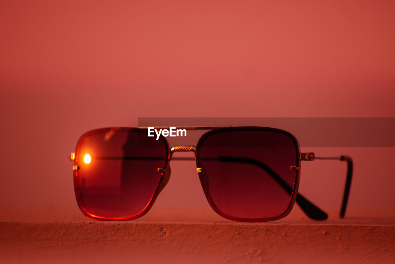 eyewear, glasses, fashion, sunglasses, vision care, red, brown, no people, single object, cool attitude, fashion accessory, colored background, studio shot, eyeglasses, indoors, copy space, reflection, personal accessory, close-up, glamour, elegance, nature