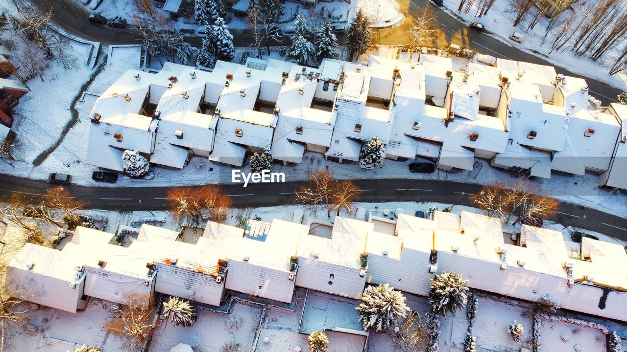 High angle view of text on snow covered city