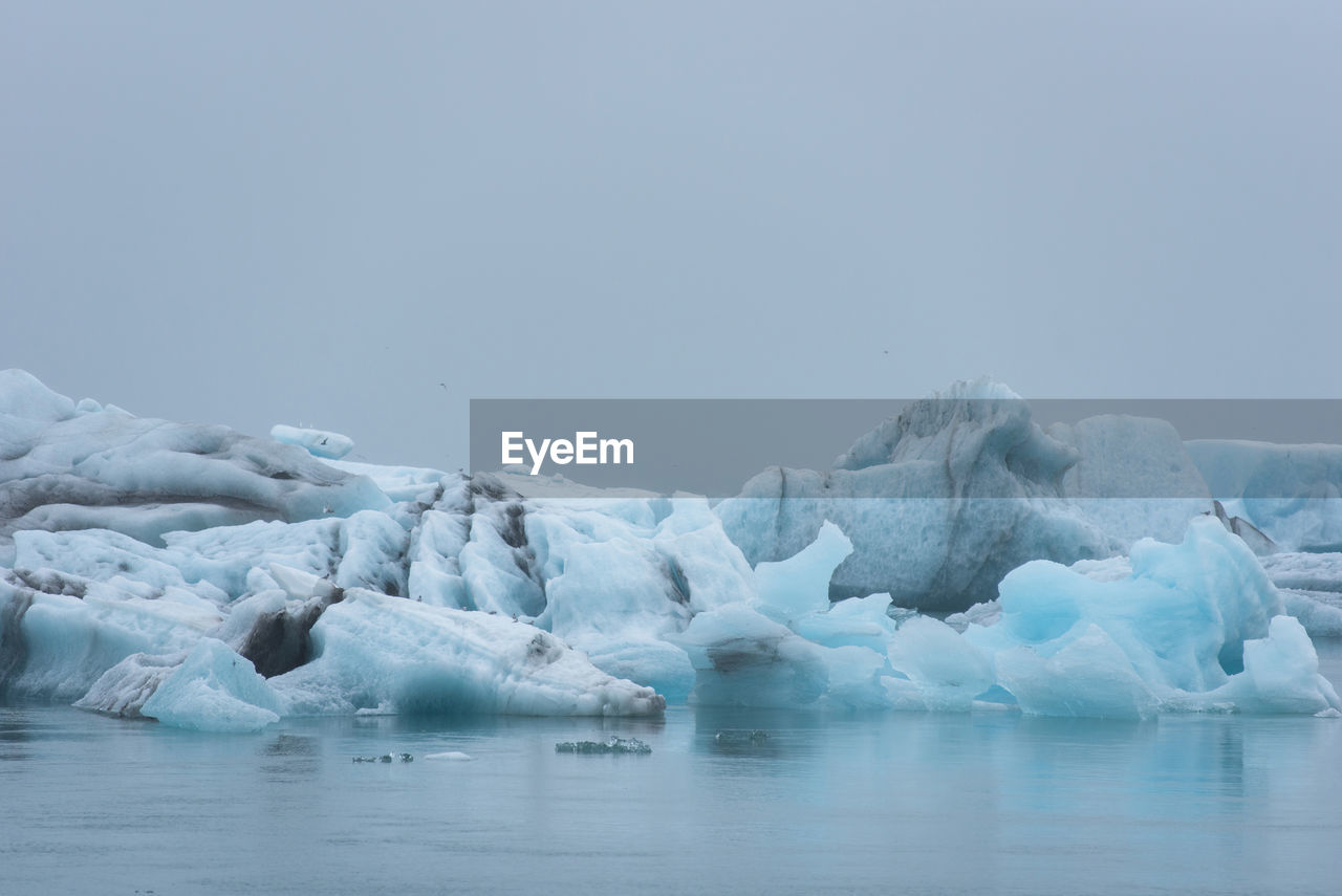 Melting icebergs, global warming, climate change floating in jokulsarlon glacial lagoon. iceland