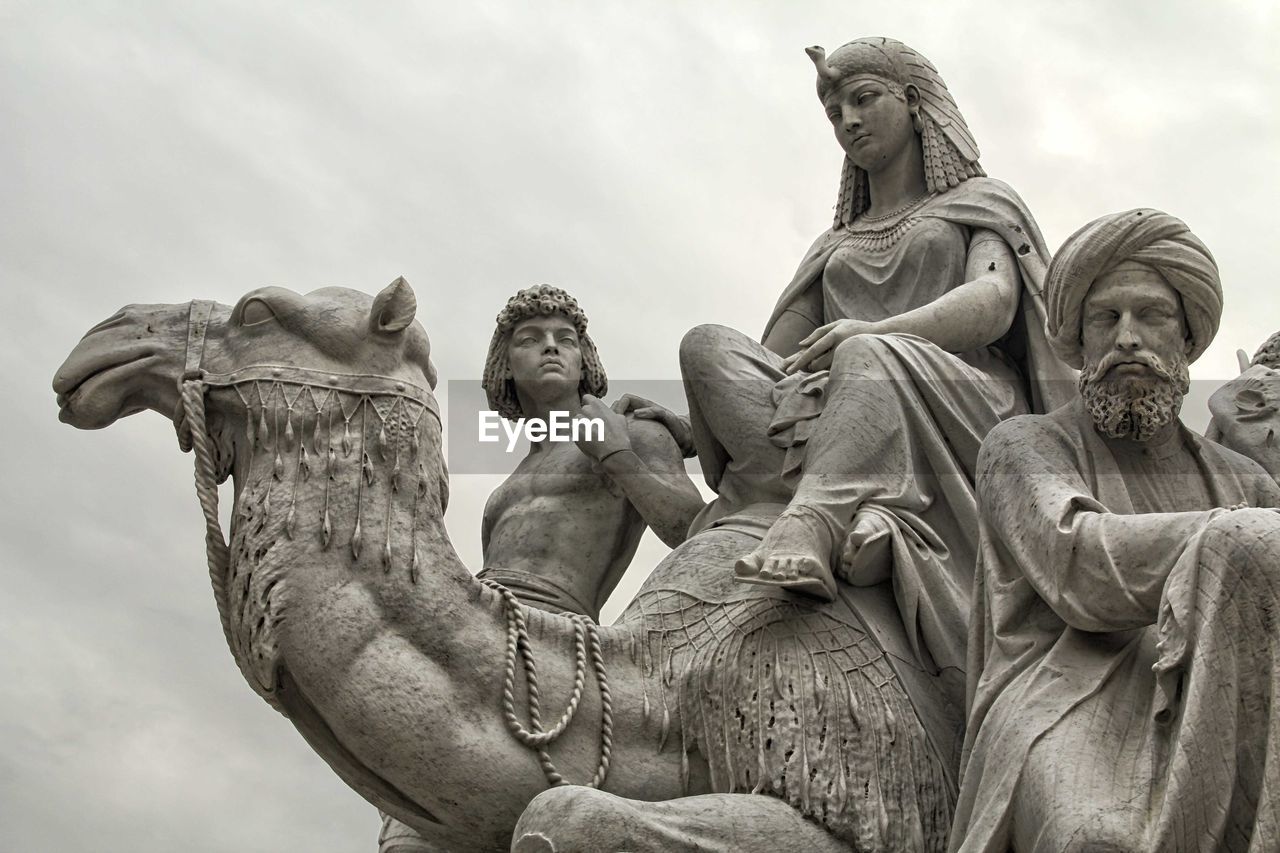 Low angle view of statue against cloudy sky