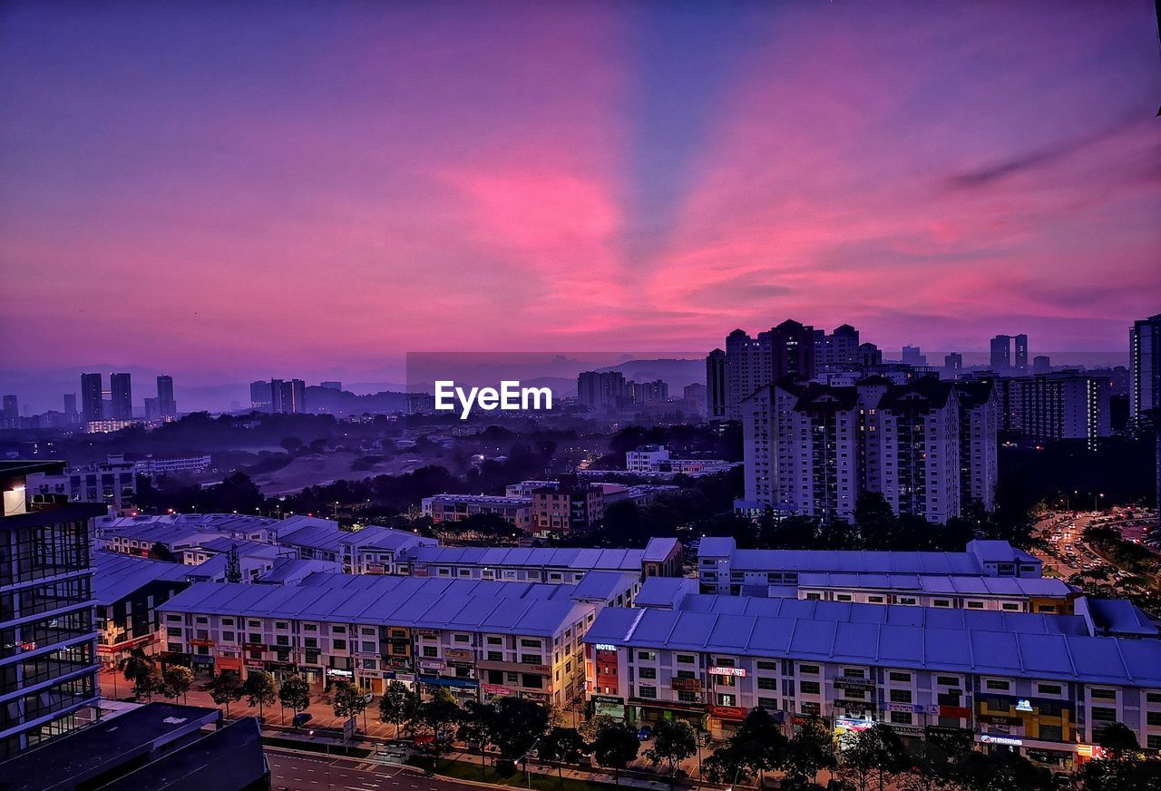 High angle view of buildings against sky at dusk