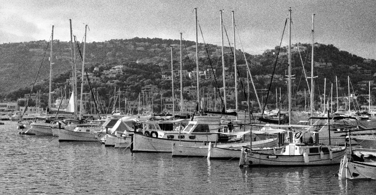 BOATS MOORED IN WATER