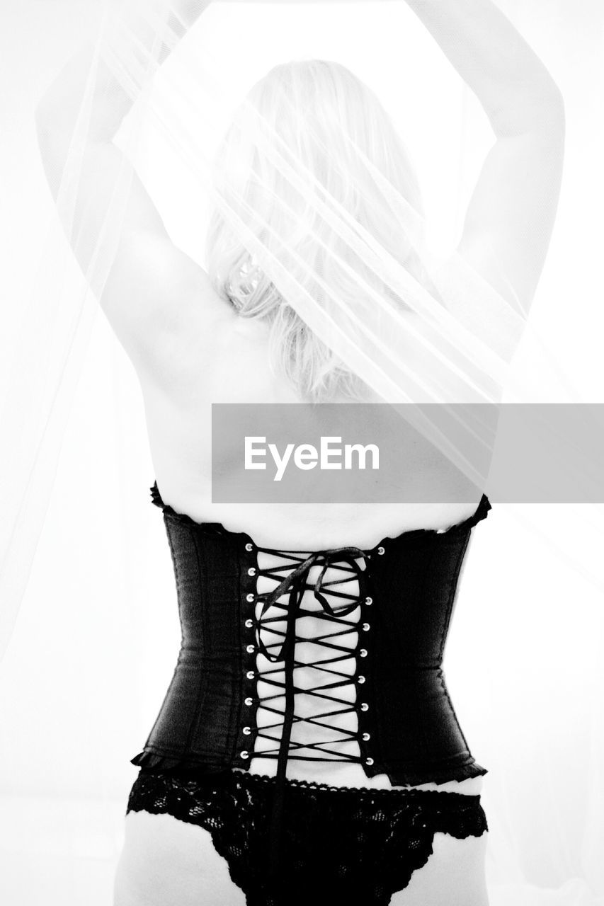 Rear view of a woman wearing corset