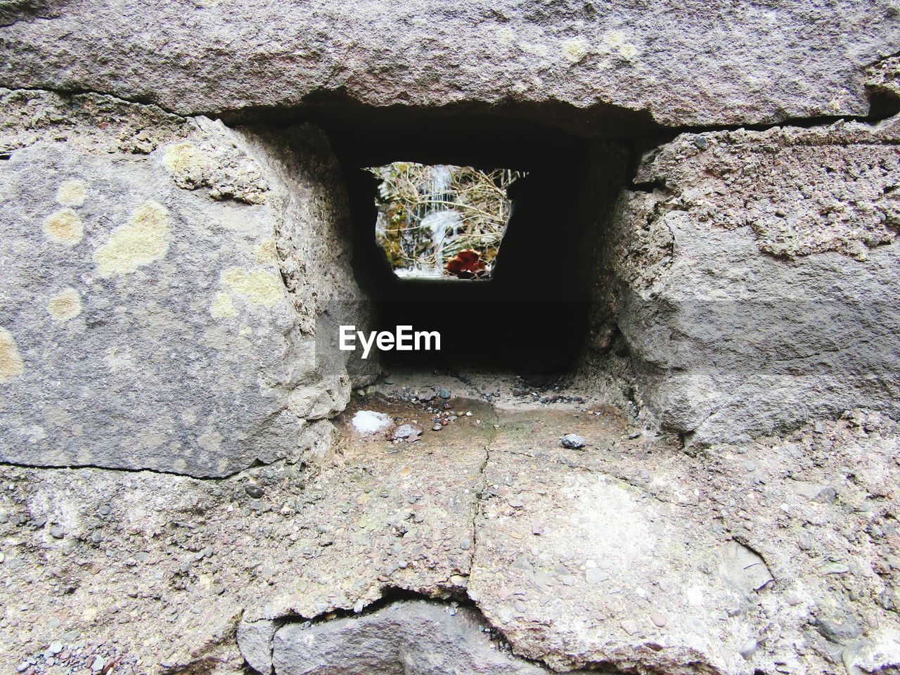 Close-up of hole in stone wall