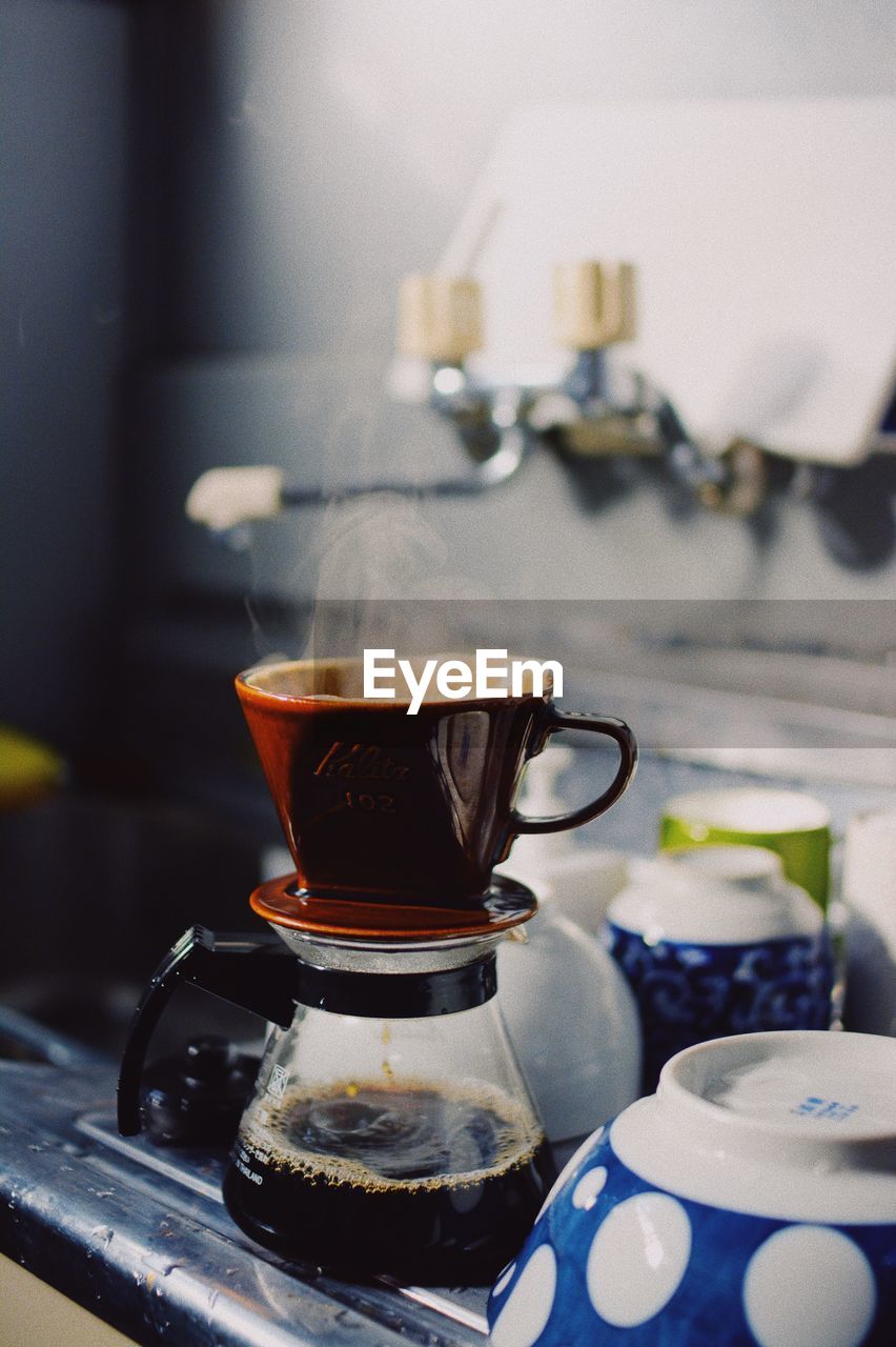 Close-up of coffee maker on table