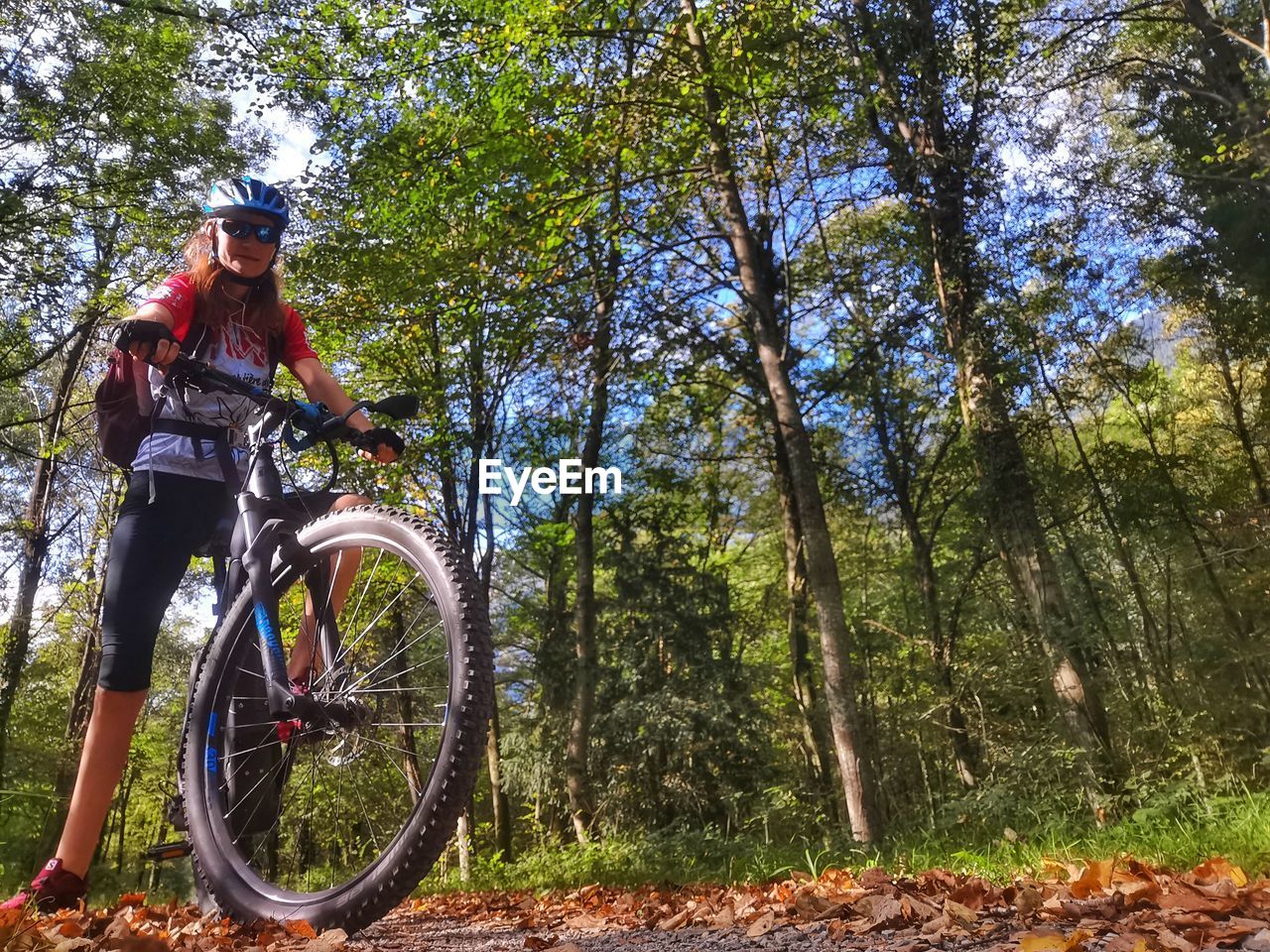 rear view of woman riding bicycle