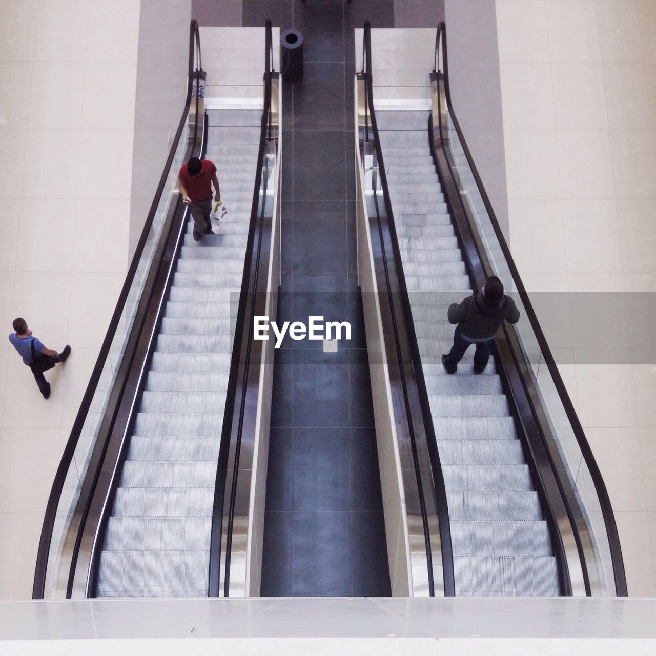 Elevated view of people on escalators