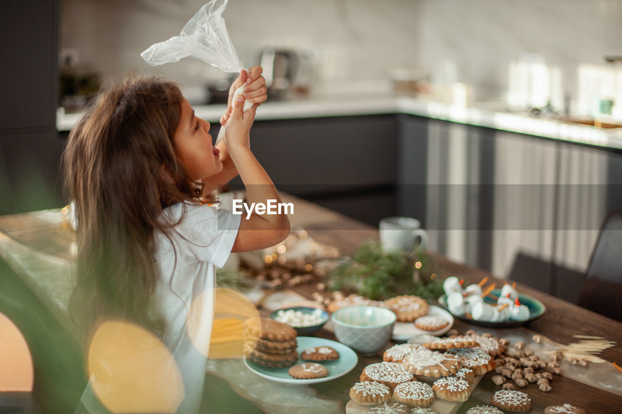 Woman having food at home