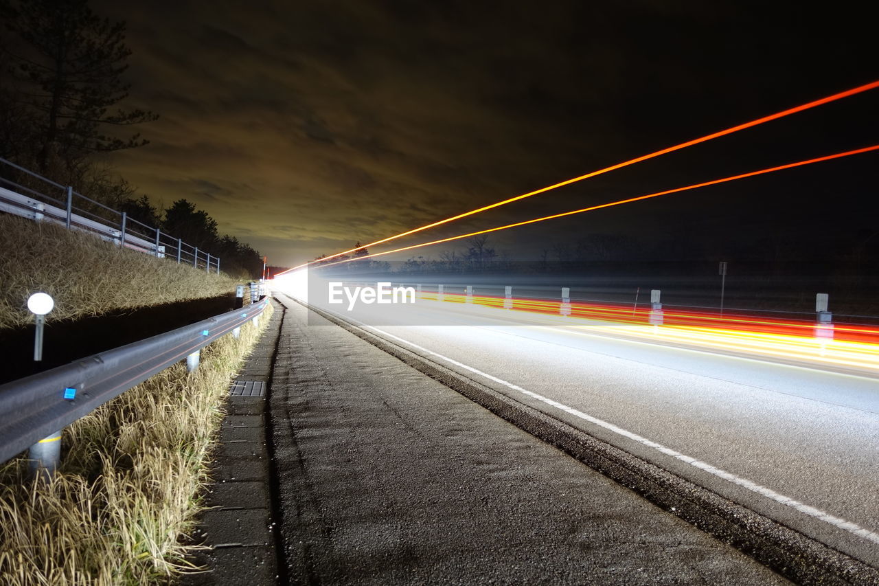 Light trails on road at night