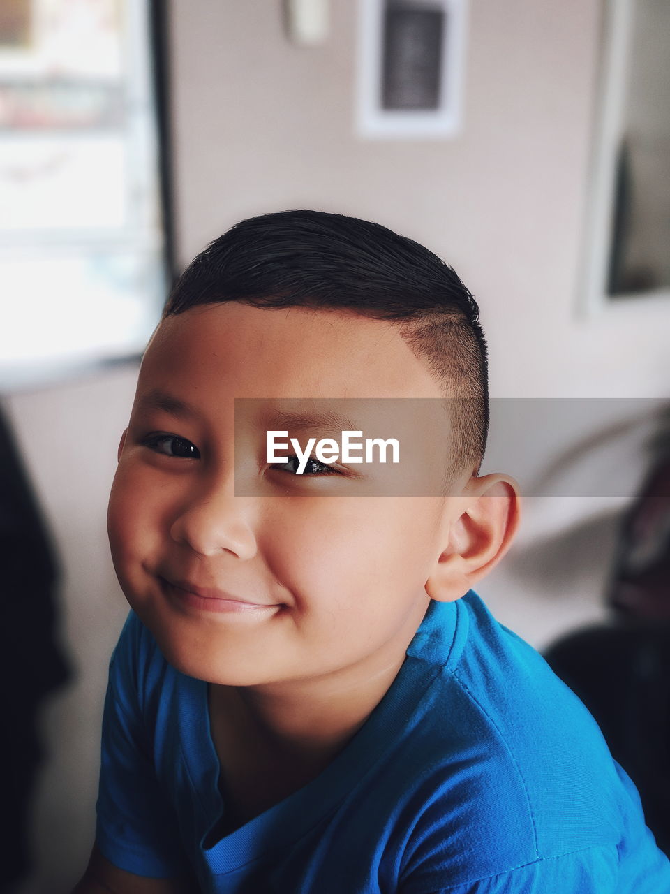 Portrait of boy smiling at home