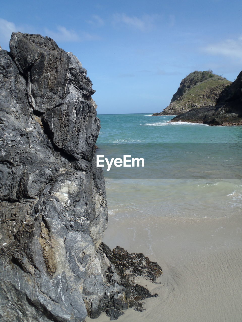 Rocky beach against the sky