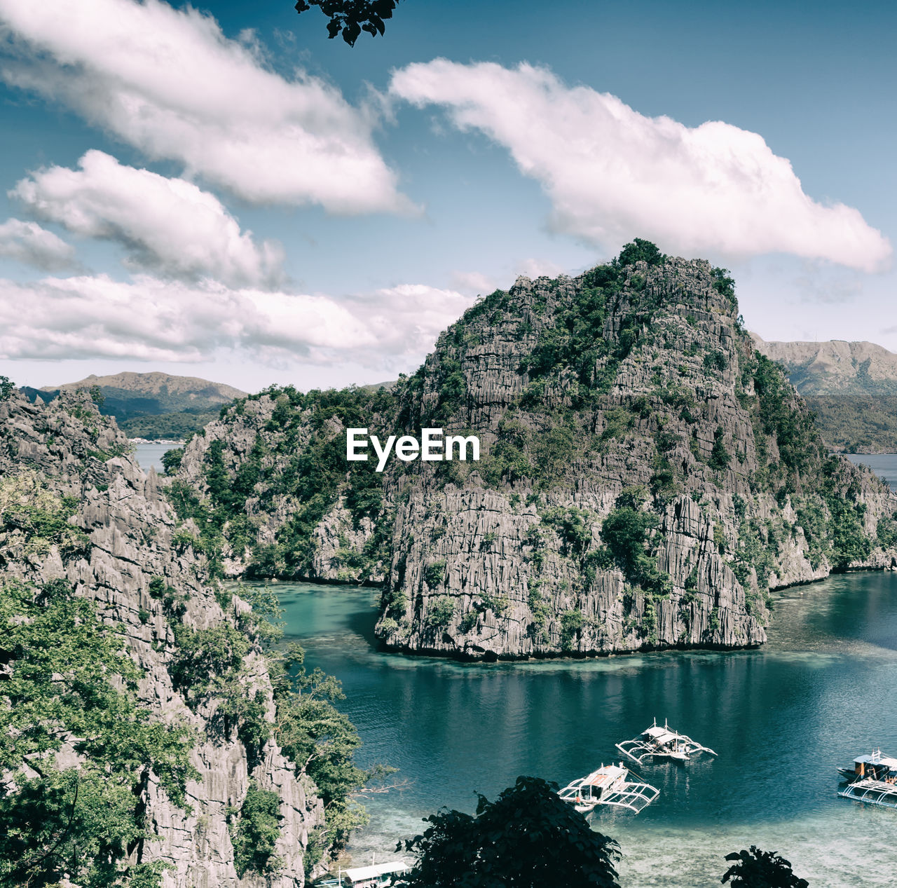 SCENIC VIEW OF TREES AND MOUNTAINS AGAINST SKY