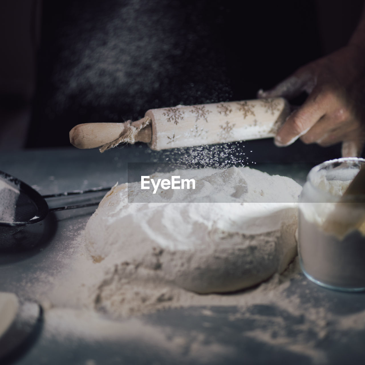 food and drink, food, hand, indoors, dough, freshness, one person, flour, preparing food, adult, kitchen utensil, occupation, icing, selective focus, household equipment, baking bread, baked, bakery, making, kitchen, close-up, sweet food, dairy, store, skill, working