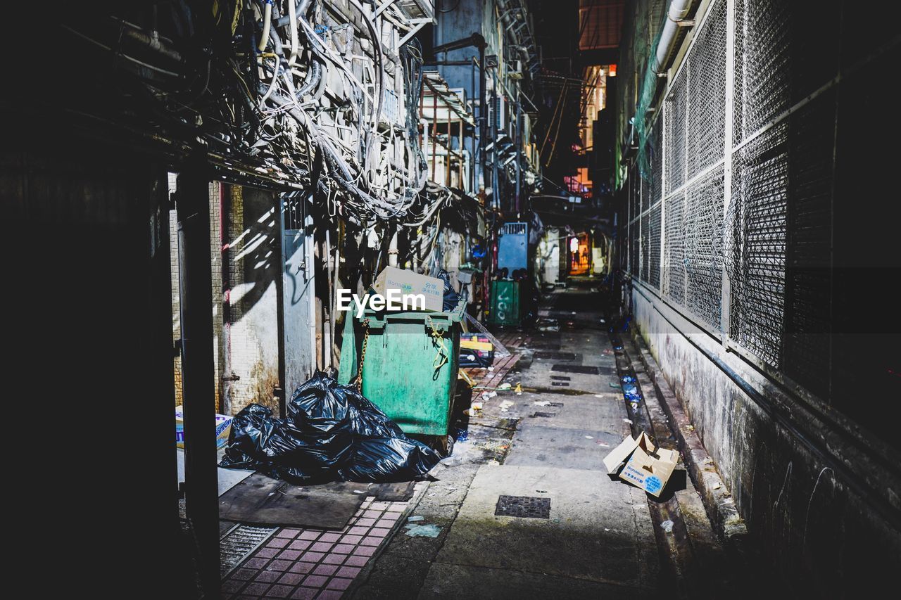 Road amidst buildings in city at night