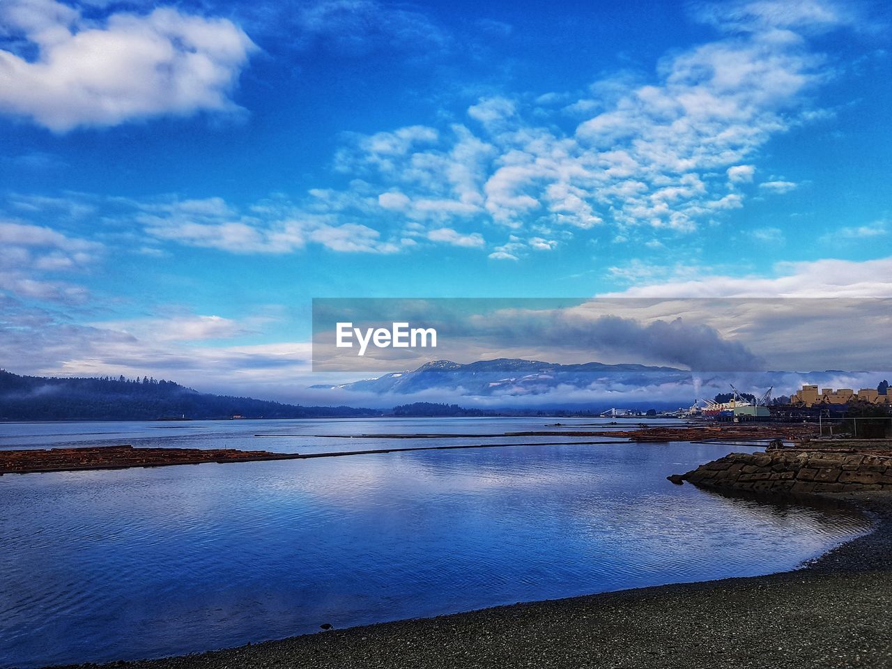 Scenic view of sea against blue sky