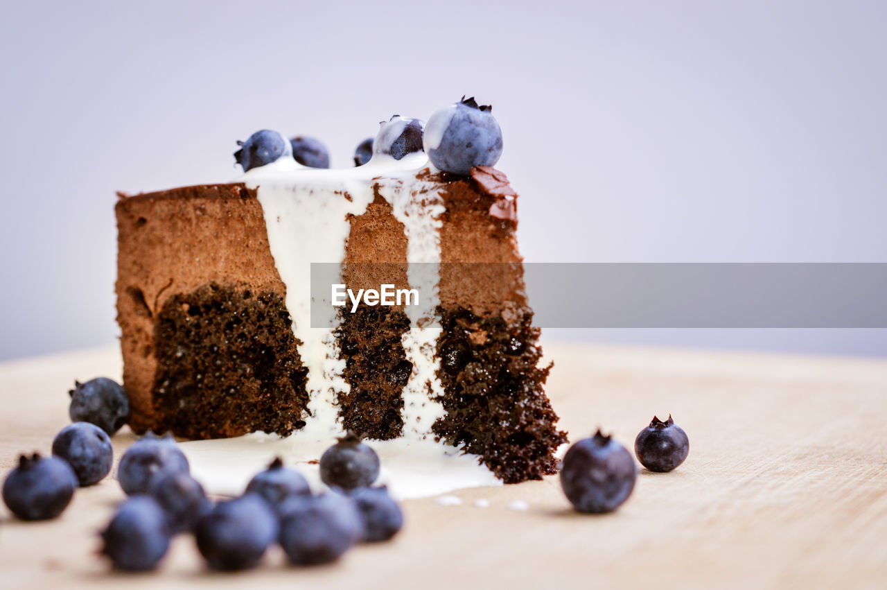 Chocolate cake with fresh cream and blueberries