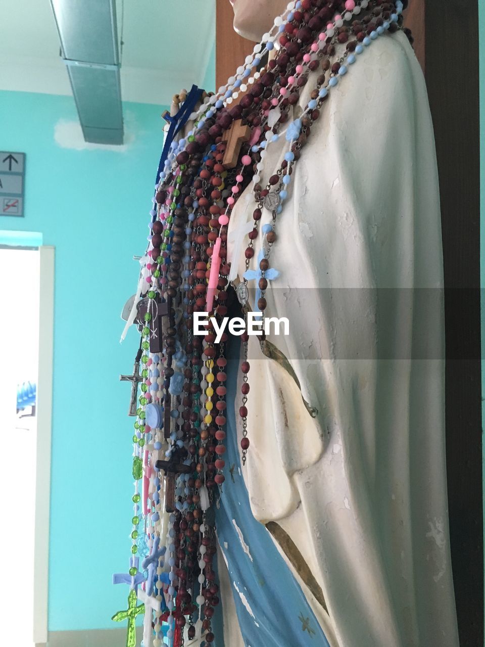 CLOSE-UP OF CLOTHES HANGING ON WALL