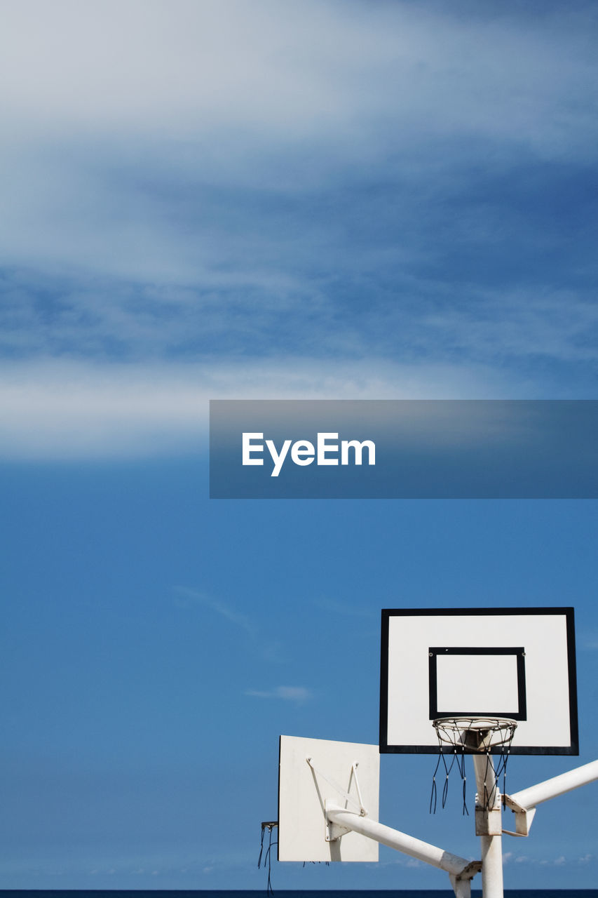 Low angle view of basketball hoop against sky