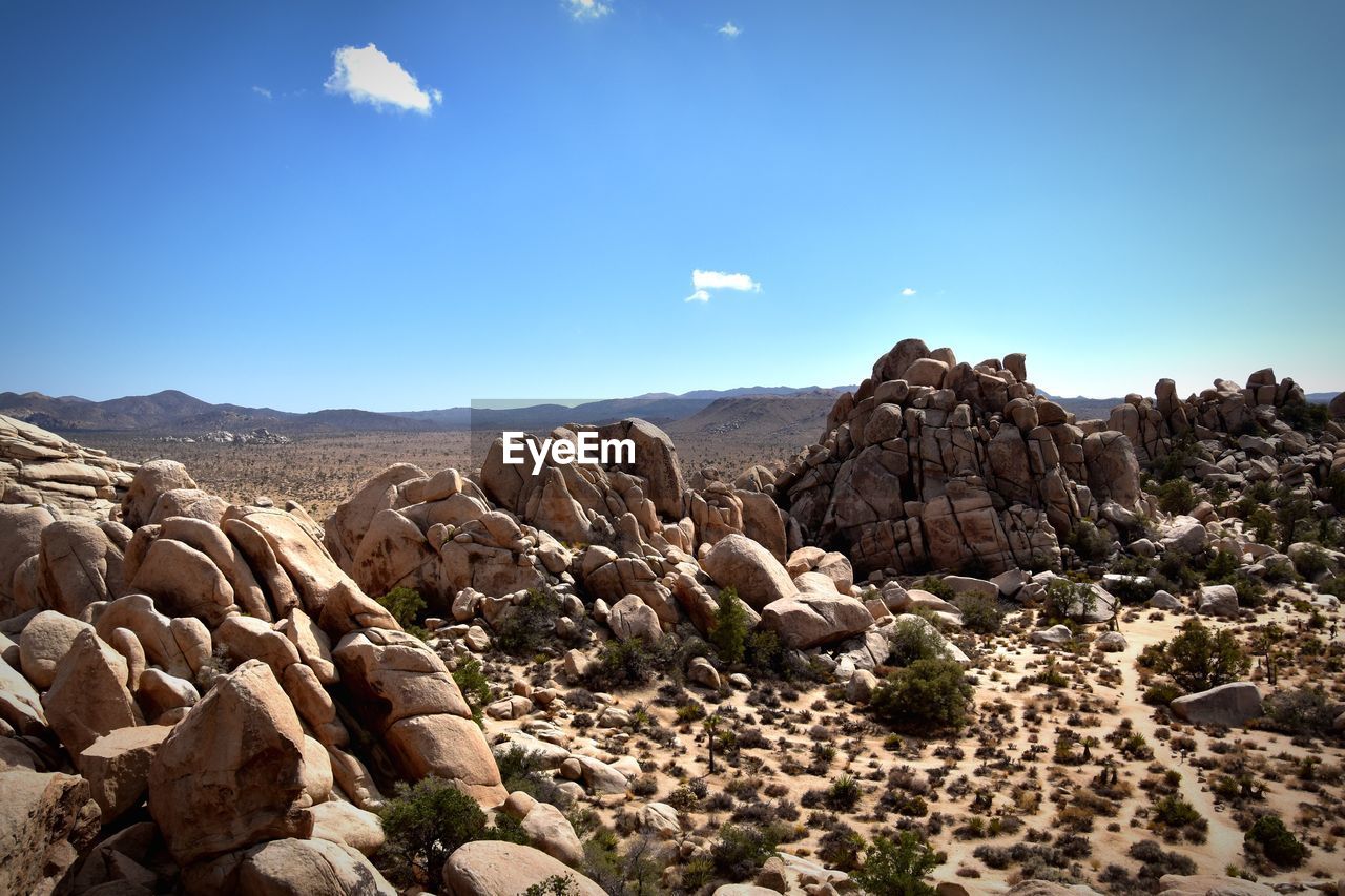 Scenic view of rocky mountains against sky