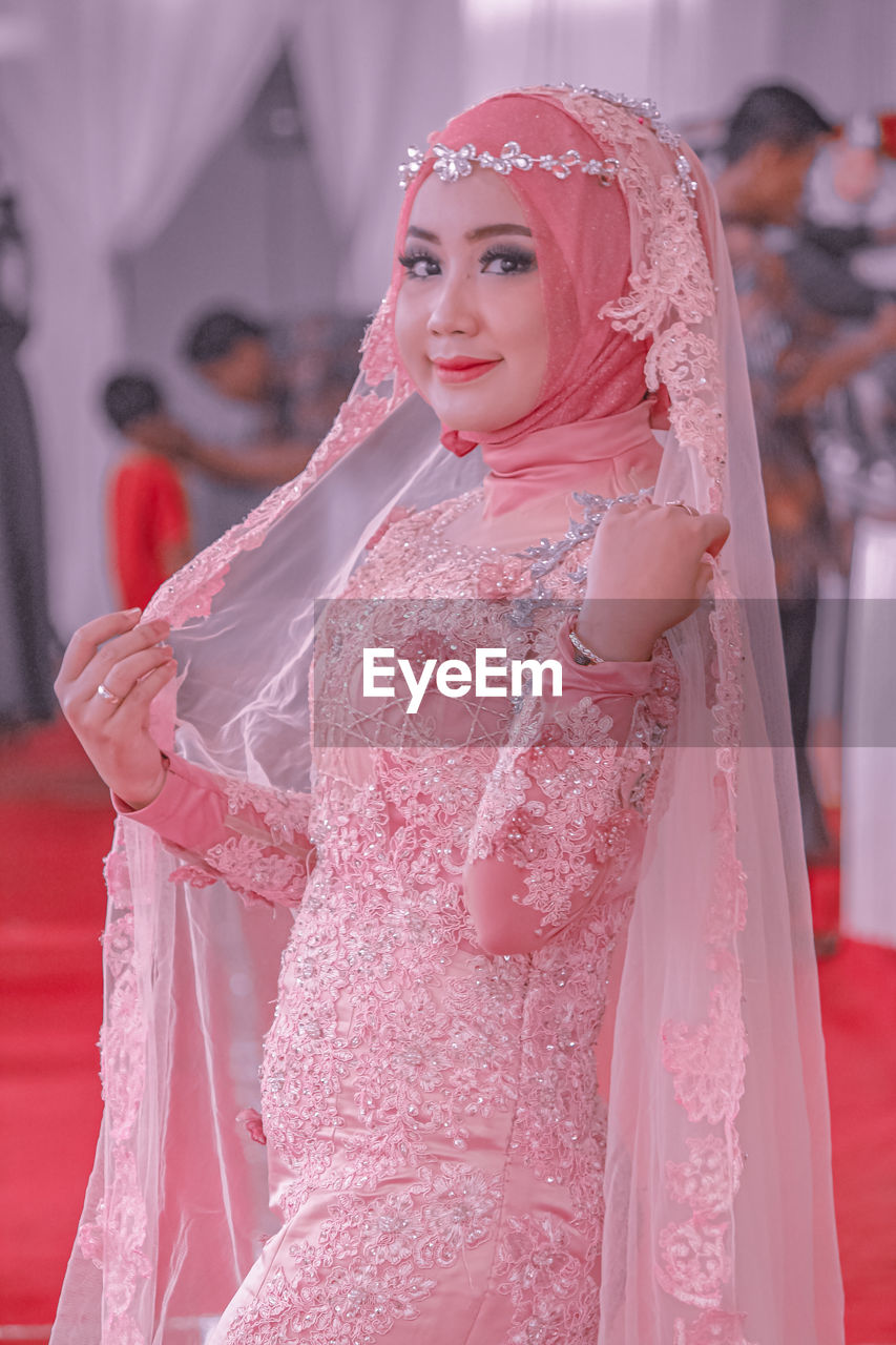 Portrait of bride standing in wedding ceremony