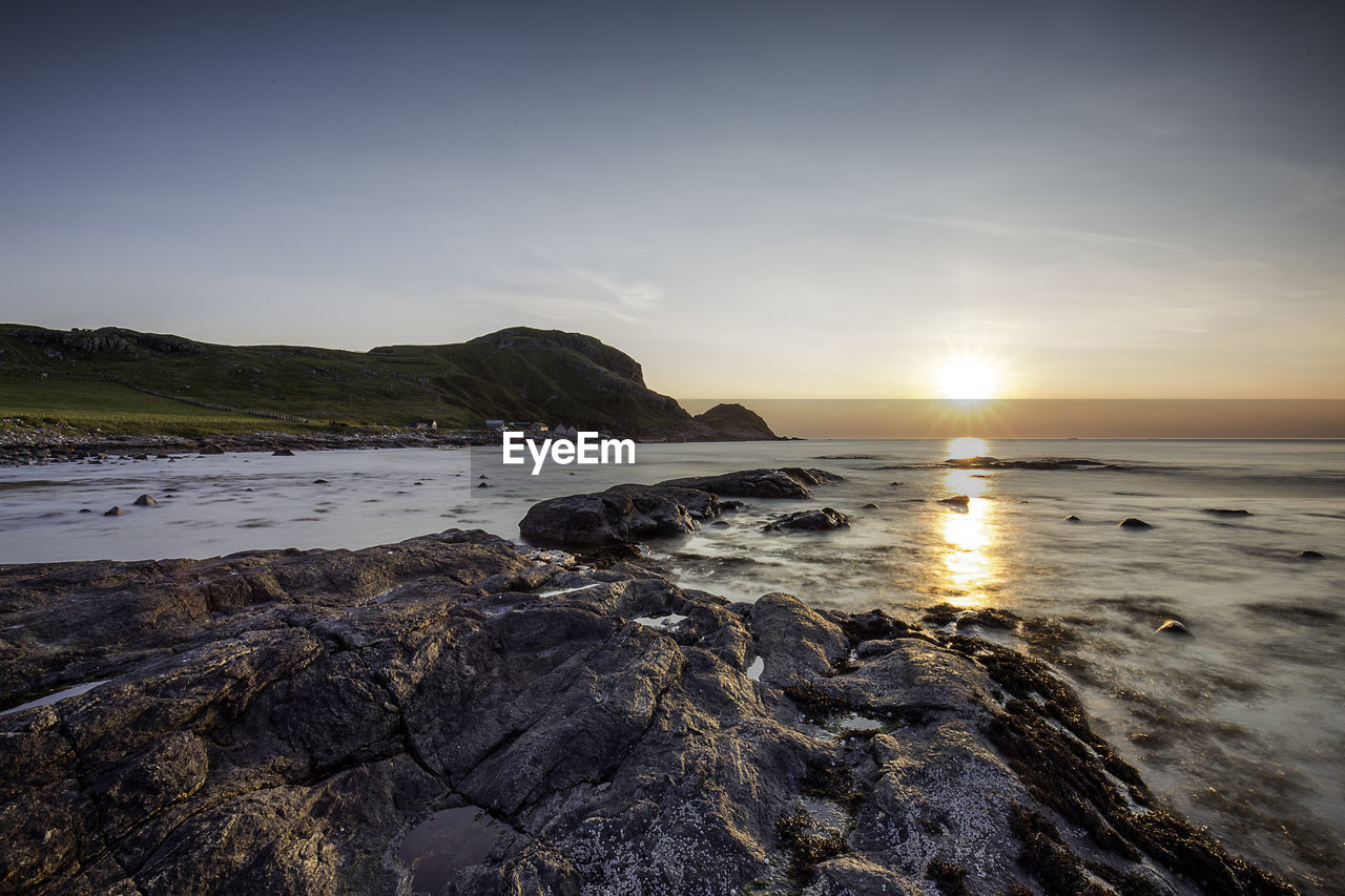 Scenic view of sea against sky during sunset