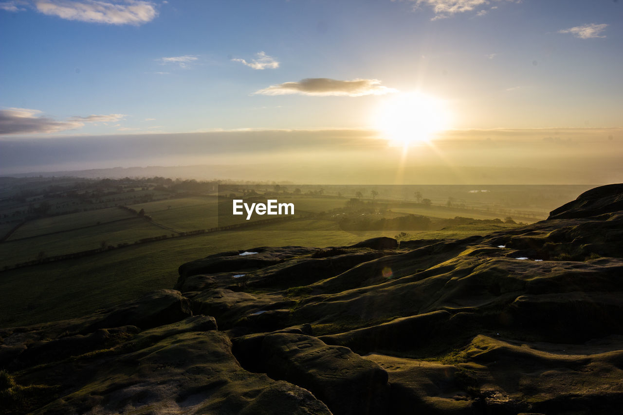 Scenic view of landscape at sunset