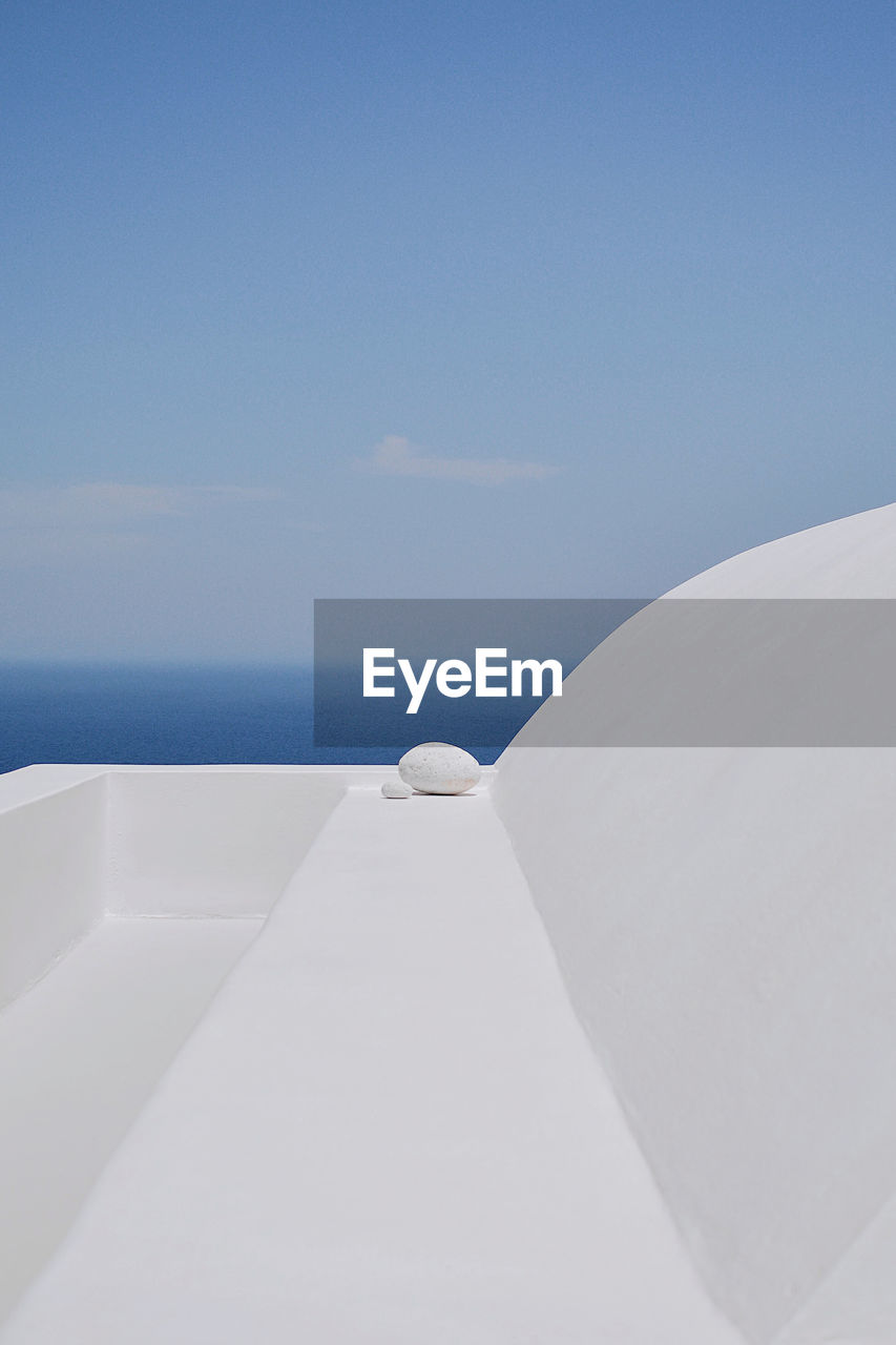 White boat on sea against blue sky