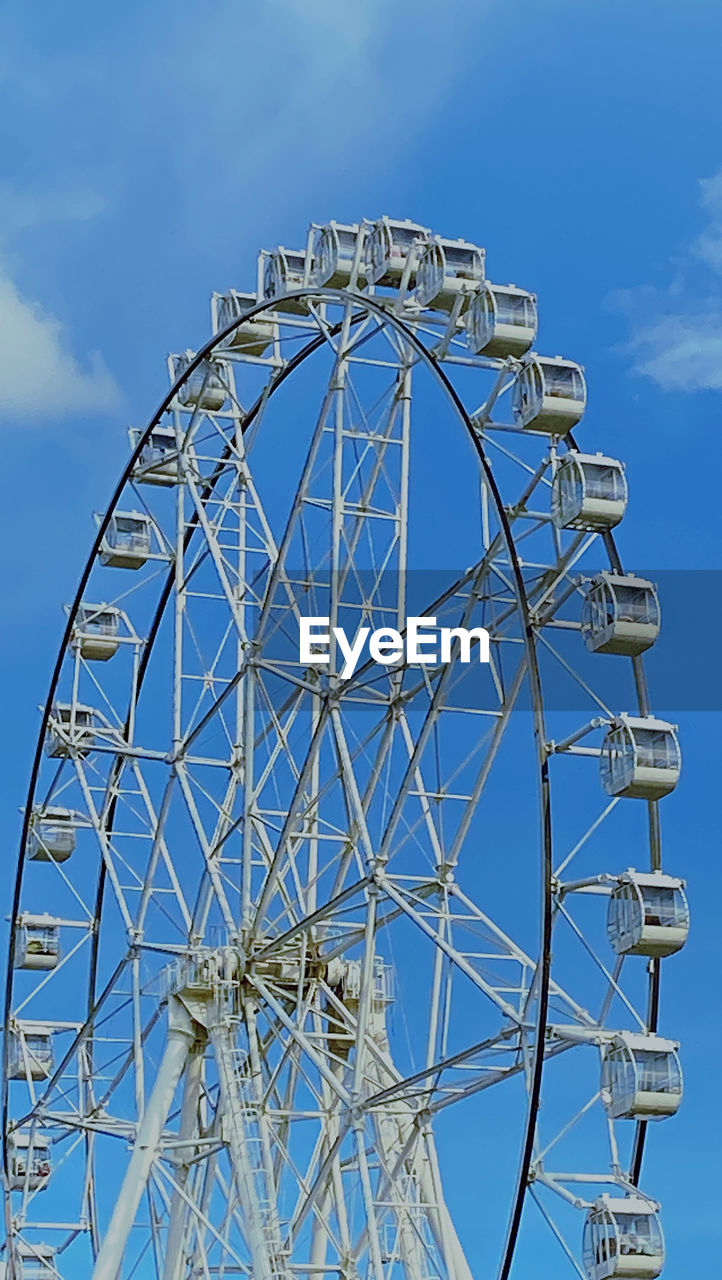 low angle view of ferris wheel against clear sky
