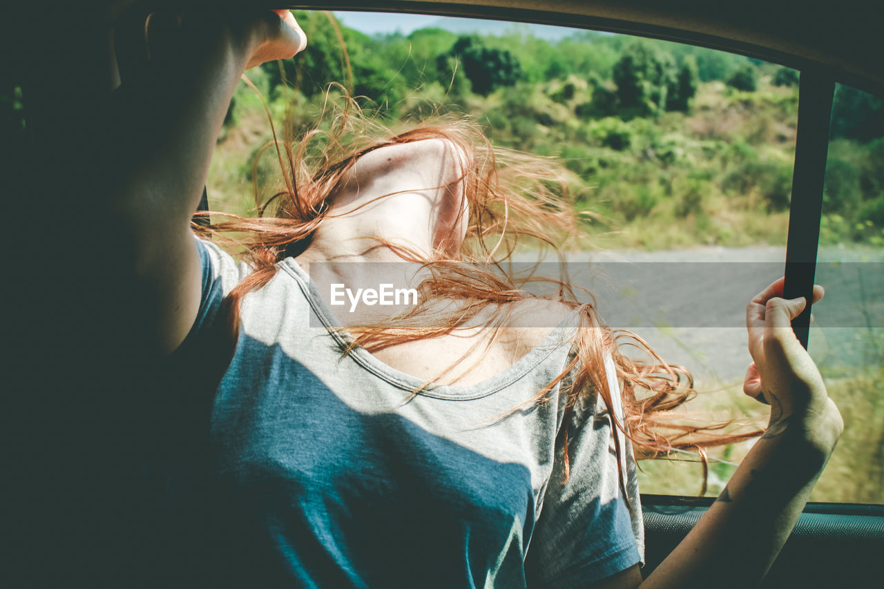 Woman looking through window