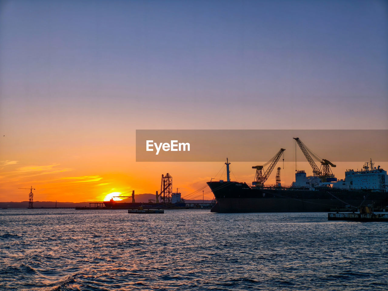 boats in sea against sky during sunset