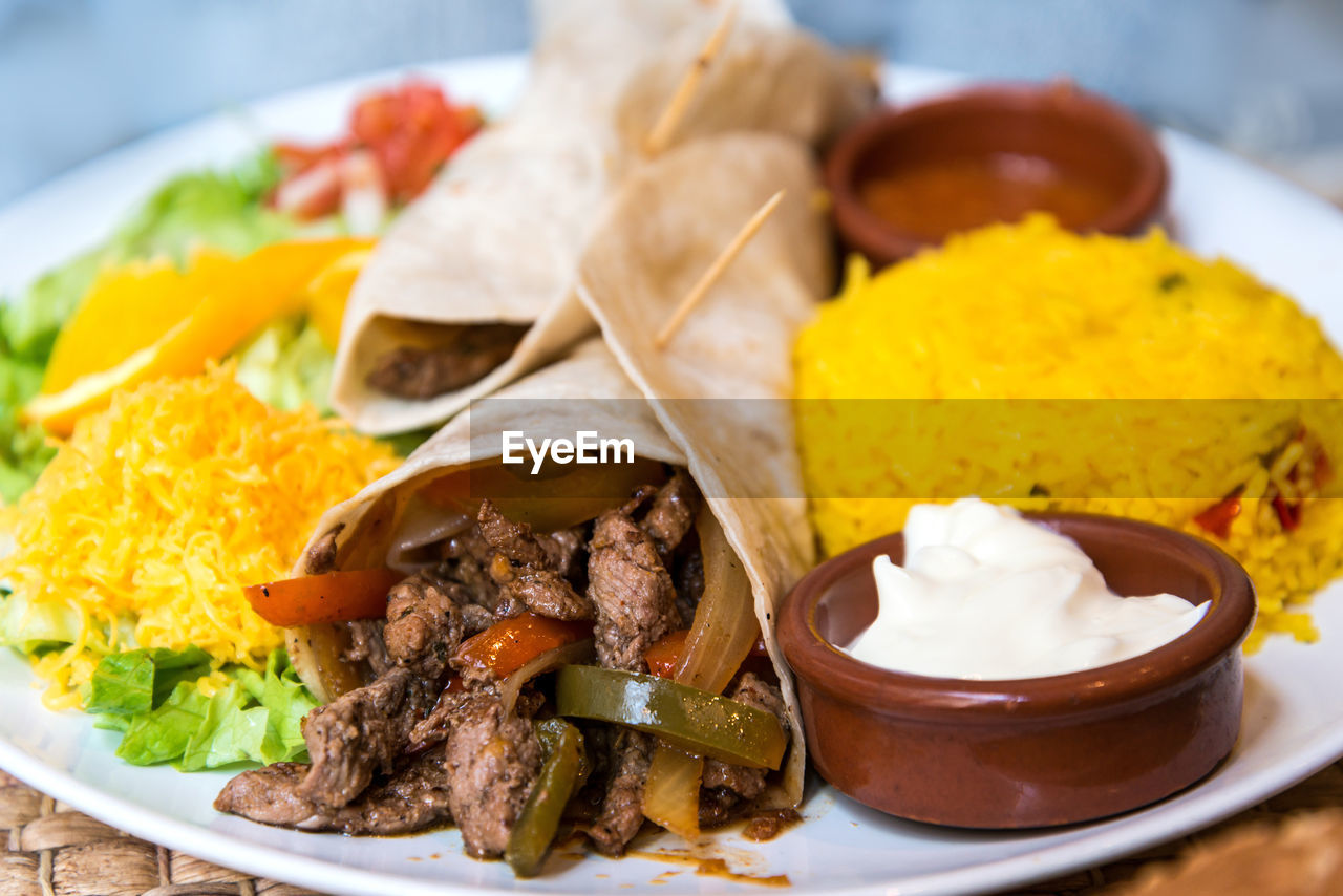 Close-up of taco and salad on plate