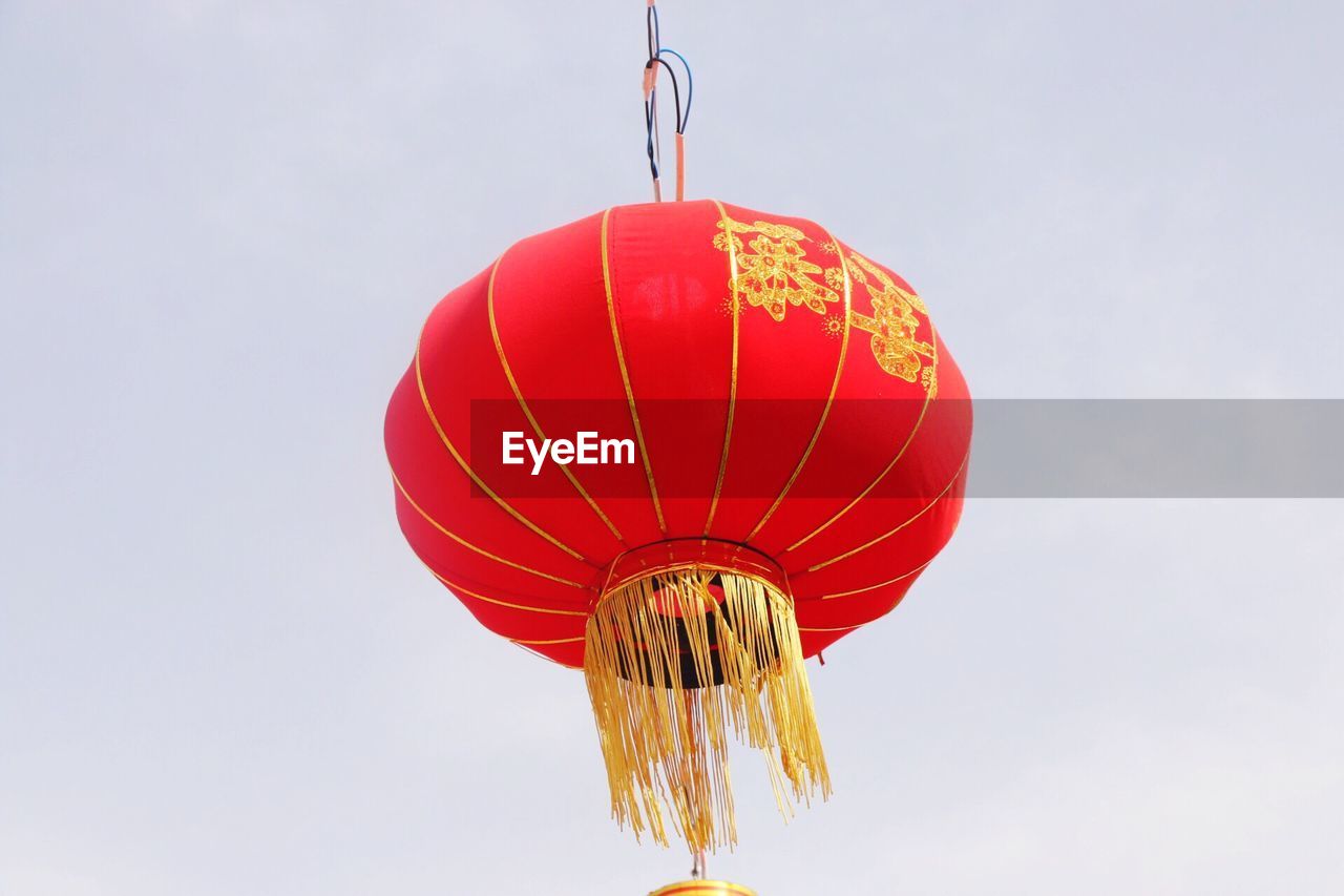 LOW ANGLE VIEW OF RED LANTERN AGAINST SKY
