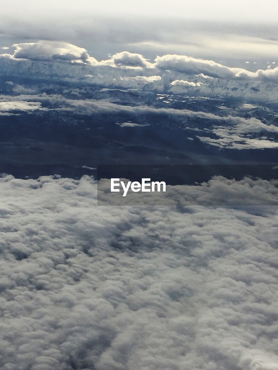 AERIAL VIEW OF CLOUDS OVER WATER