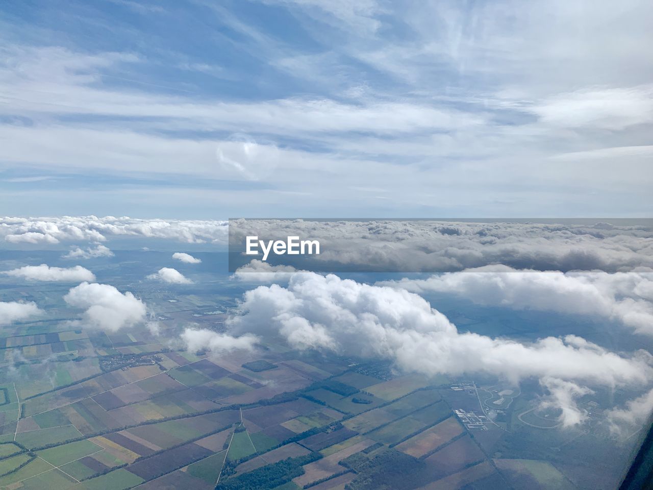 AERIAL VIEW OF CLOUDSCAPE OVER LANDSCAPE