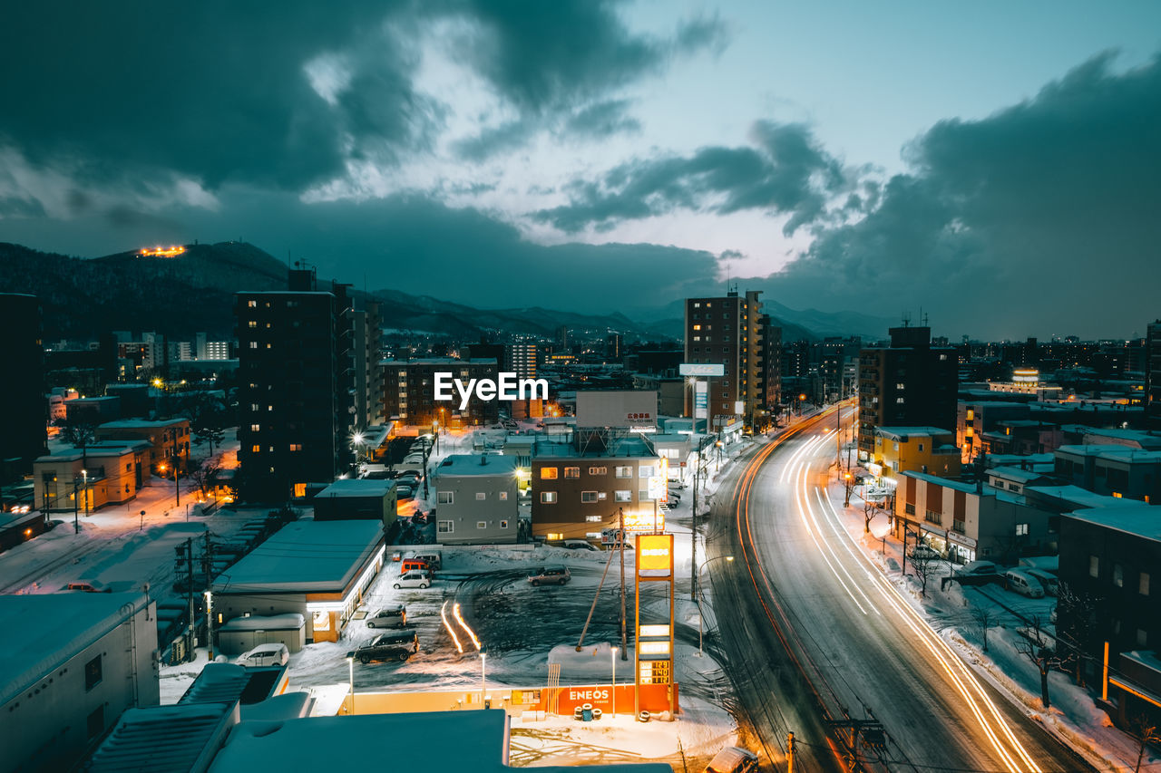 High angle view of light trails against sky at night