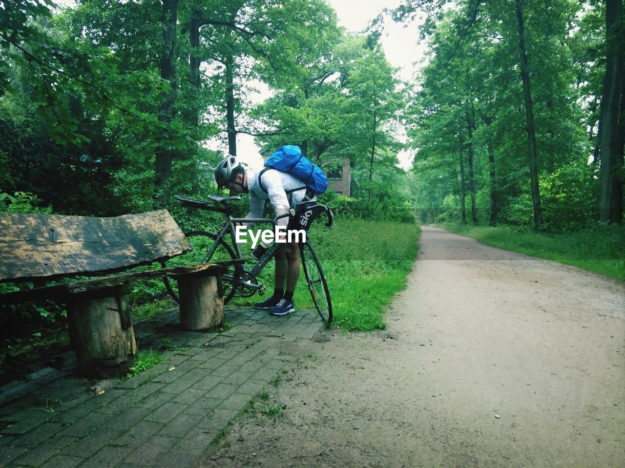 Man with bicycle on street