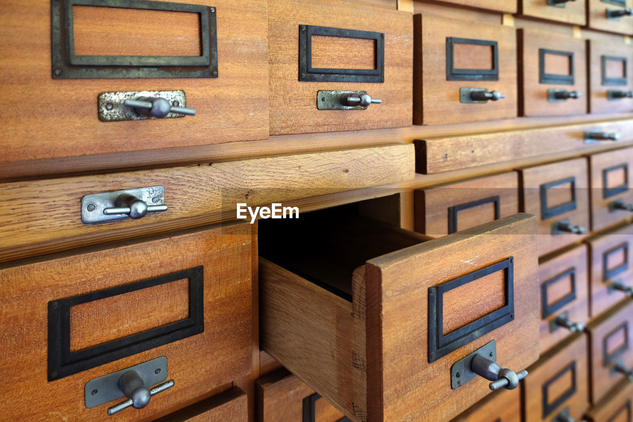 Close-up of wooden drawers used for archiving