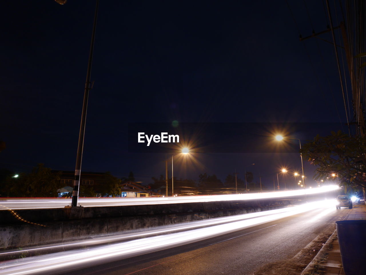 ILLUMINATED ROAD AT NIGHT