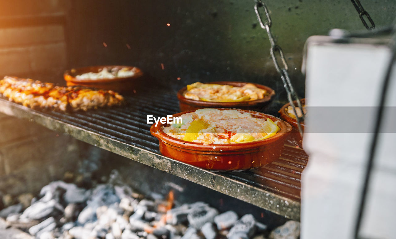 Close up shot of a mediterranean bbq barbecue grill full with fresh meat and healthy vegetarian food